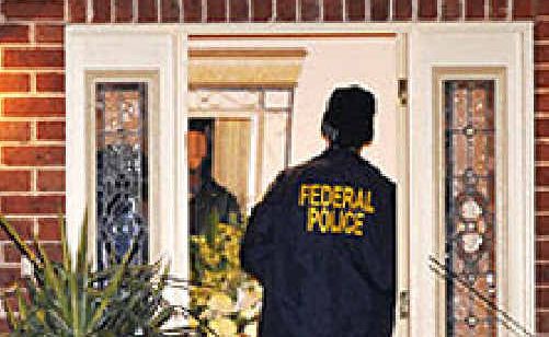 Federal police on an early-morning raid in Griffith. Federal police on an early-morning raid in Griffith.